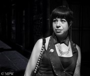 Black and white portrait of young woman in Queen St, Auckland street life